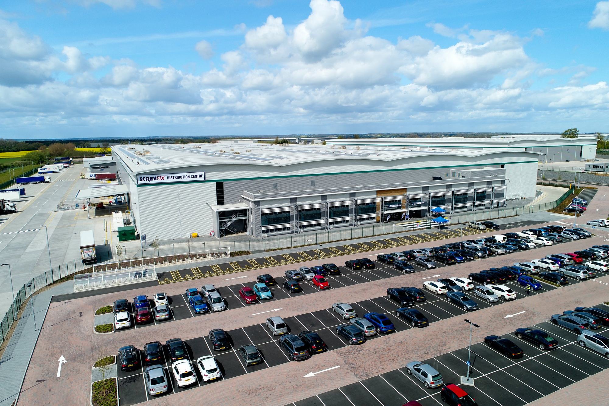 Large distribution centre and car park from the air