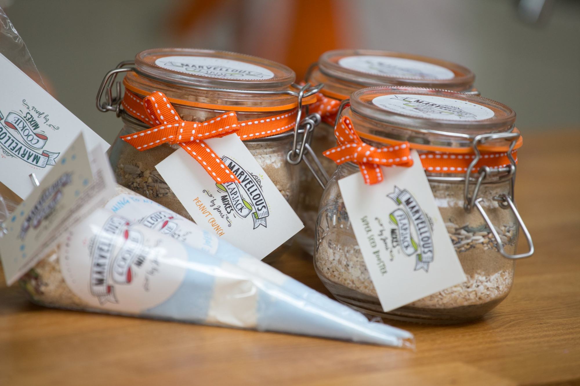 Branded flapjack and cookie mix jars with ribbon